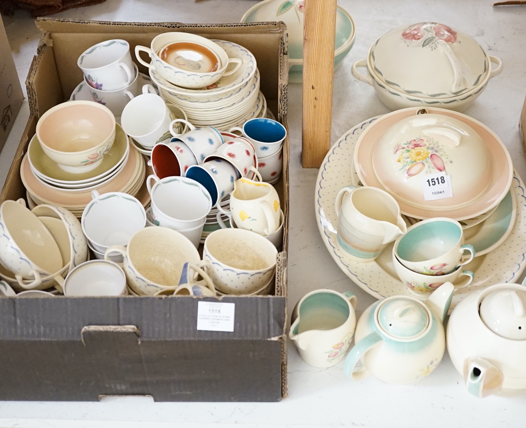 A collection of Susie Cooper ceramics and tablewares including tureens, an oval platter, cups and saucers